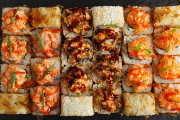 Japanese food: Set of salmon sushi and rolls with salmon and eel