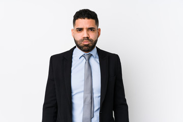 Young latin business woman against a white background isolated blows cheeks, has tired expression. Facial expression concept.