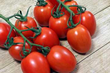 Tomatoes on a wooden table. Healthy food.