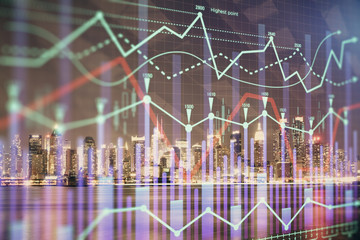 Financial graph on night city scape with tall buildings background multi exposure. Analysis concept.