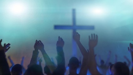 hands of a crowd of people at a Christian meeting during the   glorification praise of God against the background of the cross 3d render