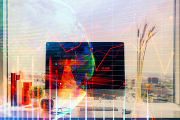 Financial market graph hologram and personal computer on background. Multi exposure. Concept of forex.