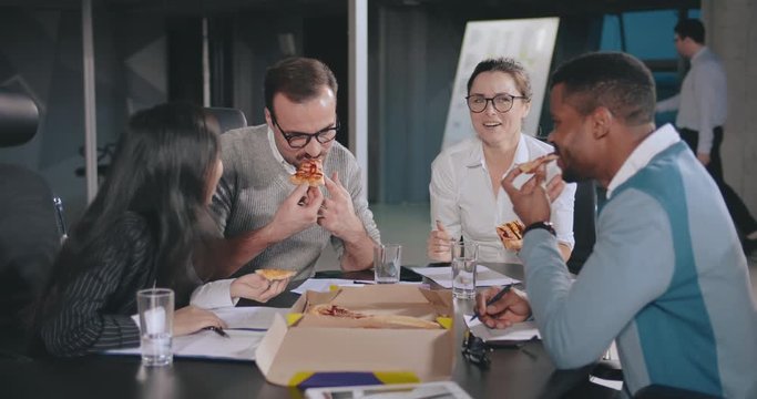 Diverse business people on lunch break in modern office