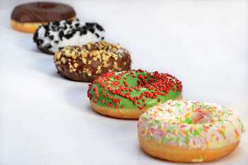 different donuts closeup on a white background 