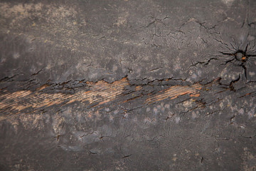 Texture of an old car tire. Worn tire tread. The danger of using an old car tire with a shallow tread concept