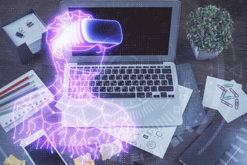 Computer on desktop with AR theme icon. Multi exposure. Concept of augmented reality.