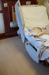 Empty hospital bed with copy space to the left