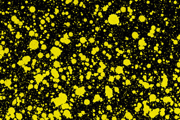 Yellow ink stains on black paper. Color splashes pattern. Blot splatter background. Spray texture for graphic design.