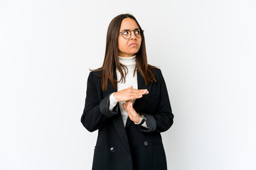 Young mixed race business woman isolated on white background showing a timeout gesture.