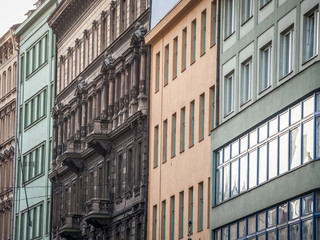 Obraz premium Facade of Old residential buildings from the 1930's in the city center of Prague, Czech Republic, used for accommodation on the real estate market