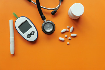  blood sugar measurement for diabetes, pills and stethoscope 