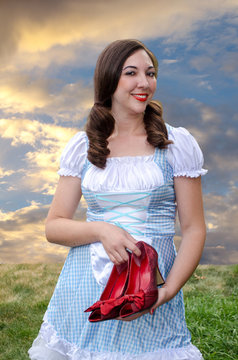 Woman holding ruby slippers