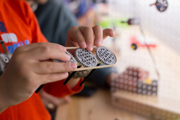 Hands on STEM education activity. Science lesson with hand made electric circuits.