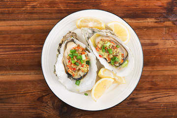 Barbecue overbaked fresh opened oyster with garlic,