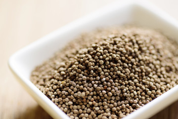 Close up of organic perilla seeds in a bowl, healthy herbal seed ingredient in Asian food
