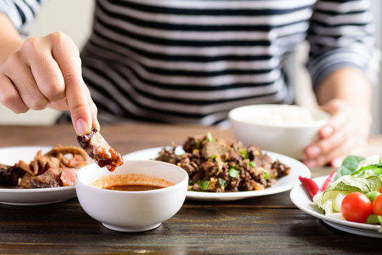 Local Northern Thai Food, Spicy Minced Pork Salad (Larb Moo Kua) Eating With Grilled Pork Dip In Chili Sauce By Hand