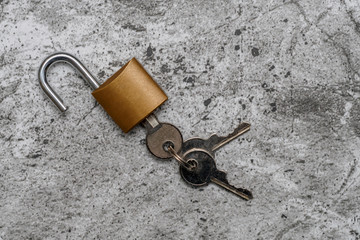 small padlock with keys on an abstract background
