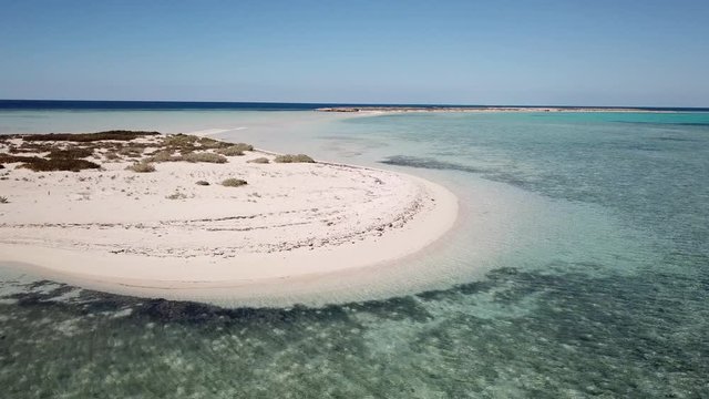 Slow drone flight over beaches of protected Umluj island group in the Red Sea in Saudi Arabia