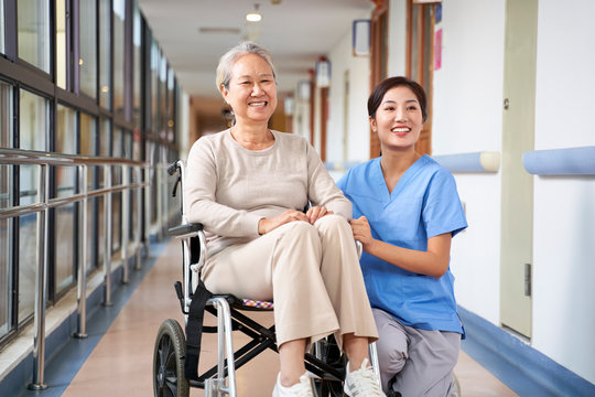 portrait of happy nursing home resident and caregiver