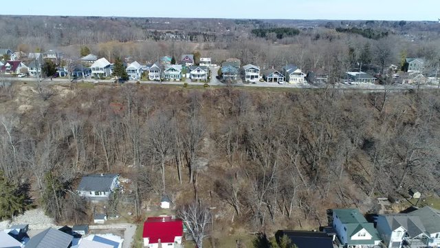 Right To Left Pan Of Two Rows Of Luxury Beach Houses In Early Spring Late Winter Drone Aerial View 002