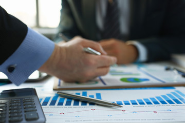 Financial statistics documents ball pen infographics at office table closeup. Internal Revenue Service inspector sum check investigation exchange market earnings savings loan and credit concept