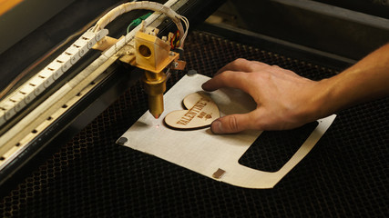 Laser cutting beam high precision on a plywood sheet. Modern technology of wood cutting. laser cut...