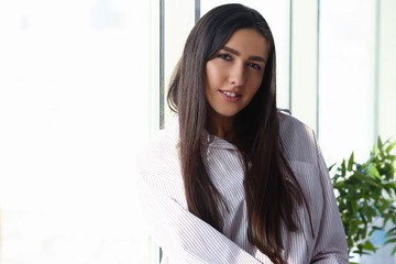 Indian woman in male shirt at home portrait bacground