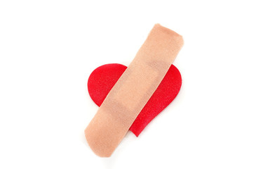 patch on a red heart on a white background. Close-up.
