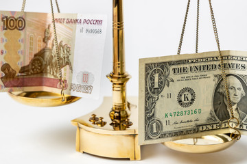 Dollar and rubles on scales on a white background. .Ruble fall concept.
