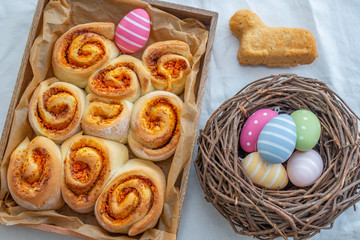 Easter holiday table. Easter cakes and colored eggs on a wooden table