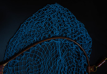 Net for catching blue and red, white and black background, black and blue net