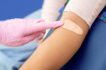 Adhesive bandage on arm.