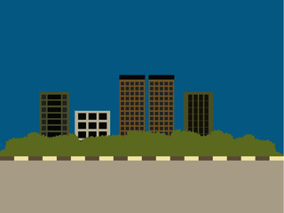 town with some skyscrapers over deep blue sky, green bush and road