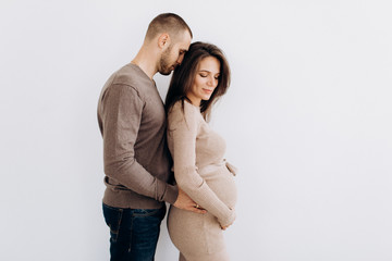 Young parents expecting a baby. Healthy family.