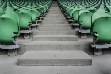 Empty plastic seats in a stadium. Matches to be played without fans.