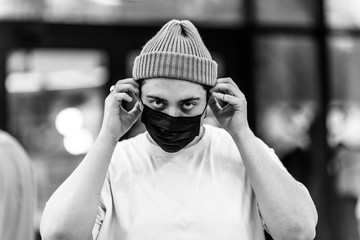 A man puts on a mask from a virus. Flu epidemic.