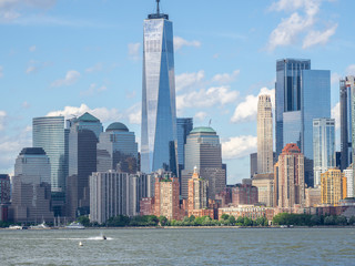Obraz premium New York, NY, USA. Amazing skyline of Manhattan skyscrapers and buildings from Ellis Island. Landscape inclusive of the Freedom tower - One World Trade Center