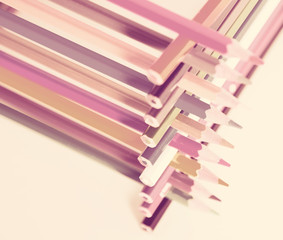 pencils stacked in log house