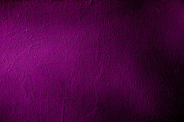 Texture of old purple crumpled paper in low light with strong dimming for the background