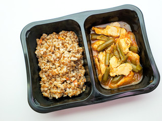 Healthy food, buckwheat and chicken with string beans on an isolated background.