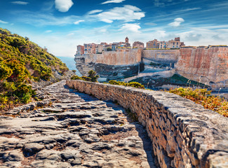Colorful morning cityscape of Bonifacio town. Sunny summer view of Corsica island, France, Europe....