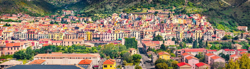 Panoramic morning cityscape of Bosa town, Province of Oristano, Italy, Europe. Sunny summer scene of Sardinia. Architecture traveling background.