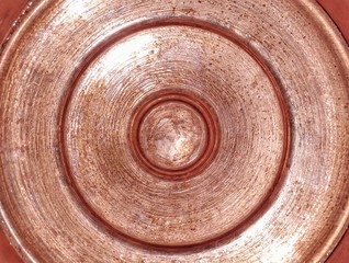 Texture of copper jug cap. Closeup image of copper vessel.