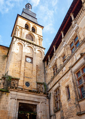 Fototapeta na wymiar Sarlat in Aquitaine, France. The capital of Périgord Noir, a medieval village full of picturesque alleys and monuments. View of the bell tower of the Gothic Romanesque Cathedral of 