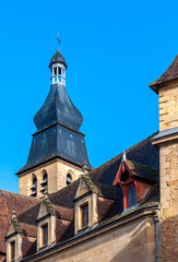 Fototapeta na wymiar Sarlat in Aquitaine, France. The capital of PÃ©rigord Noir, a medieval village full of picturesque alleys and monuments. View of the bell tower of the Gothic Romanesque Cathedral of 