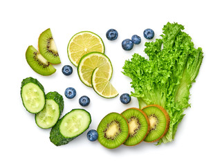 Naklejka na ściany i meble Fresh green salad, cucumber, kiwi vegan juicy food background. Healthy diet concept. Mixed fruits salad isolated on white. Variety of fresh green veg fruit for juice or smoothie. Detox clean eating