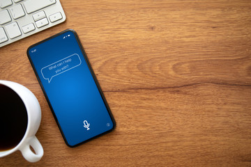 phone with app personal assistant on the screen over table