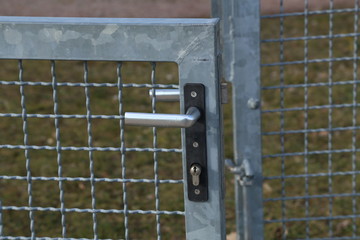Metal mesh gate with internal lock and handle