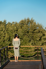 Female tourist enjoying sunset at Mangrove park in Abu Dhabi, UAE