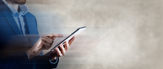 businessman holds tablet in hand